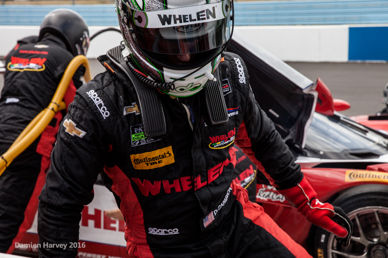 Dane Cameron exits the No. 31 Action Express Corvette Daytona Prototype during a driver change.